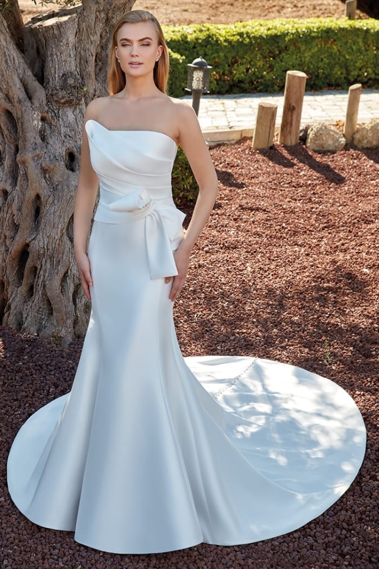 Model wearing white Eddy K Bridal dress