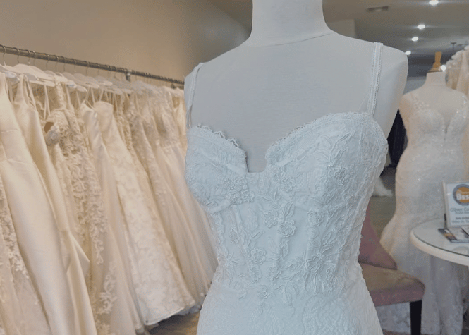 Bridal gown display inside wedding dress boutique