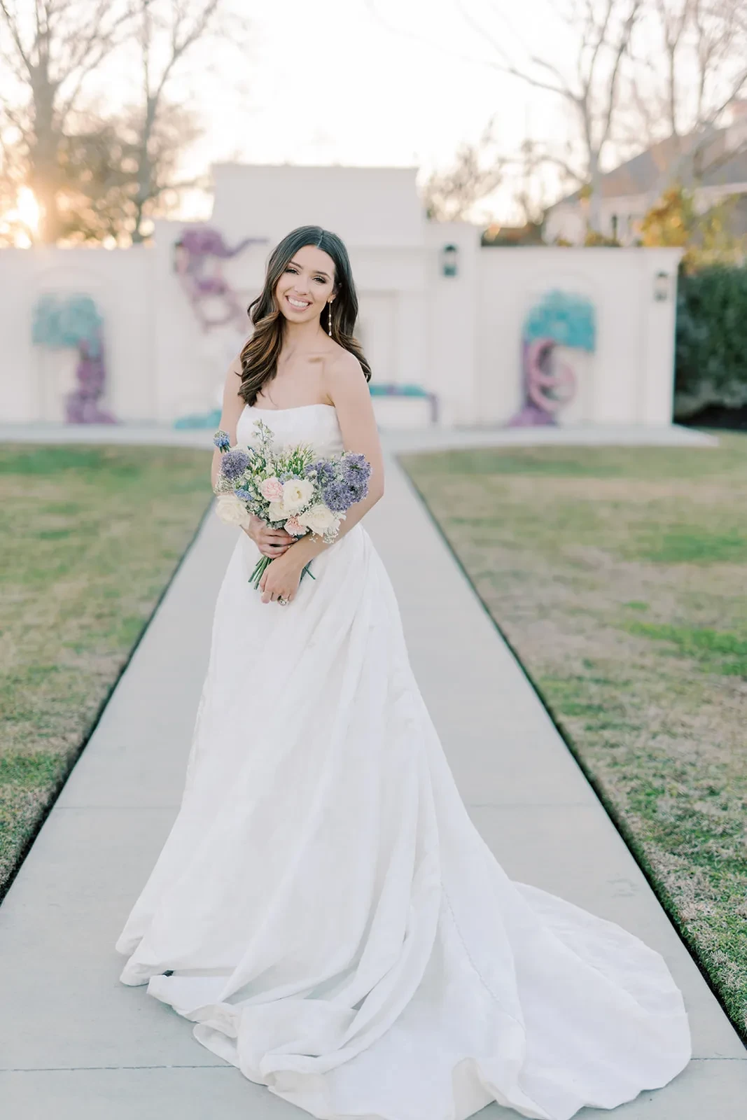 Model wearing white Alfred Sung Bridal dress