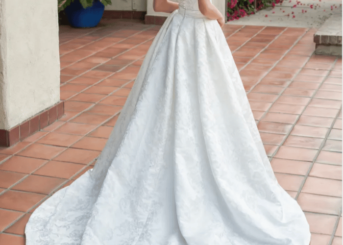 Ball gown wedding dress with subtle pattern and court train