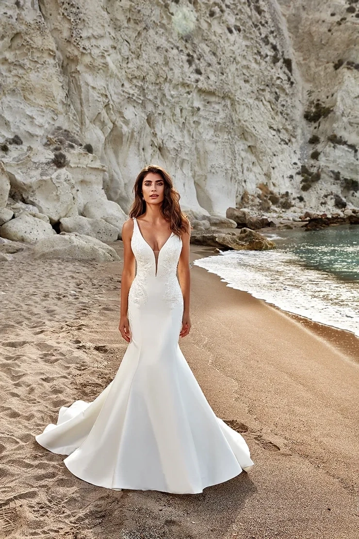 Model wearing white Eddy K Bridal dress