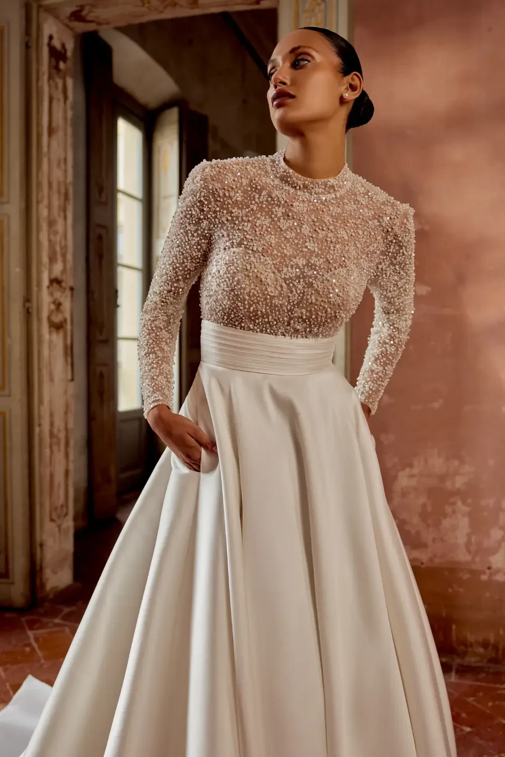 Model wearing white Justin Alexander dress