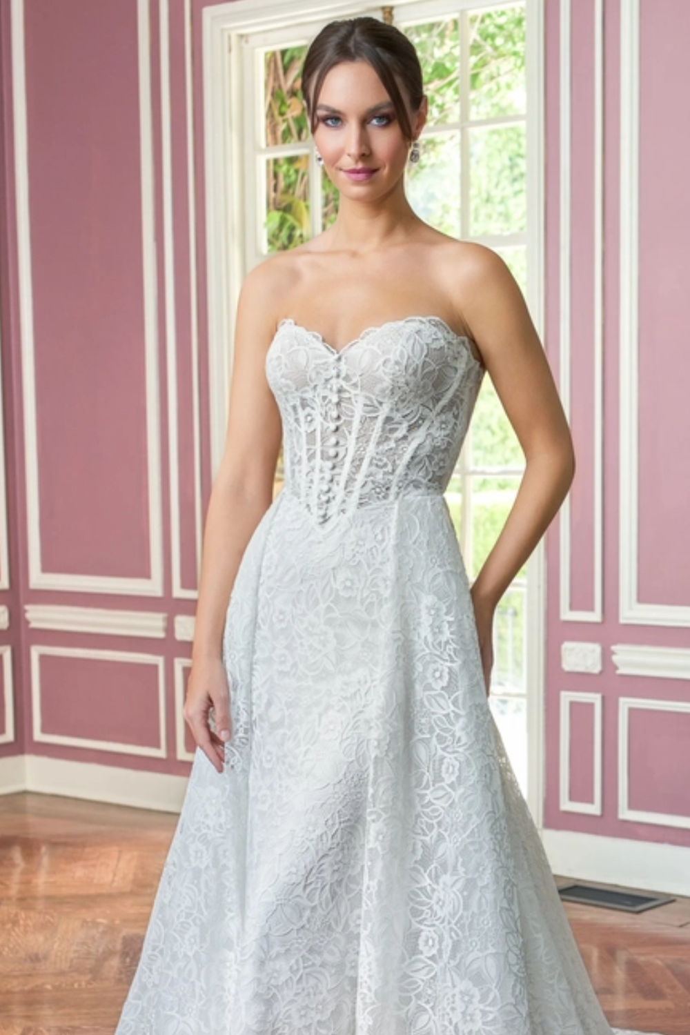 Model wearing white Jasmine Bridal dress