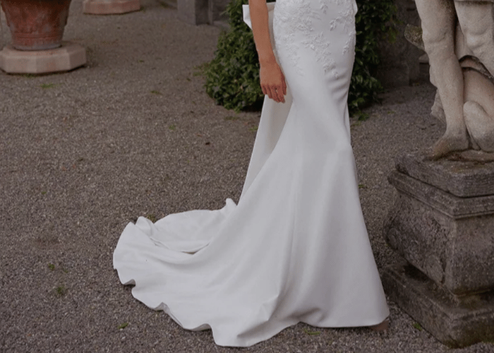 Fitted mermaid wedding dress with simple sweep train